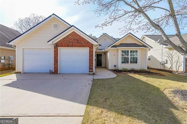 ranch-style home with brick siding, an attached garage, concrete driveway, and a front lawn