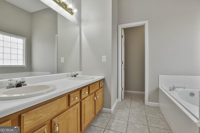 bathroom with a garden tub, double vanity, and a sink