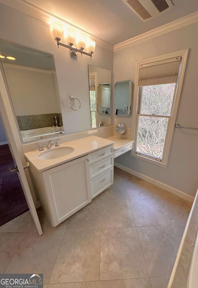 bathroom with visible vents, crown molding, tile patterned flooring, baseboards, and vanity