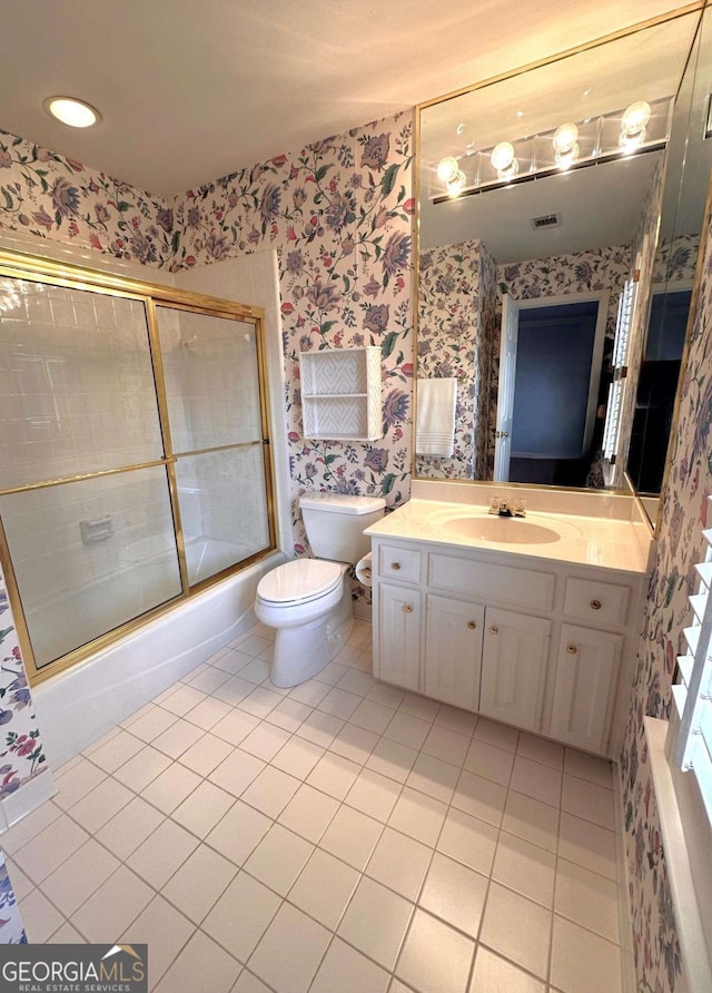 full bathroom with vanity, enclosed tub / shower combo, wallpapered walls, tile patterned flooring, and toilet