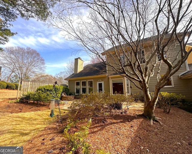 rear view of house with a chimney