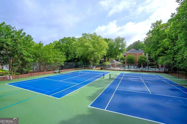 view of tennis court with fence