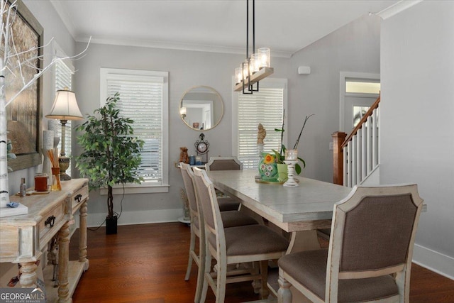 408 Davis St, Monroe, GA 30655 - dining area with dark wood-style flooring, crown molding, and stairway
