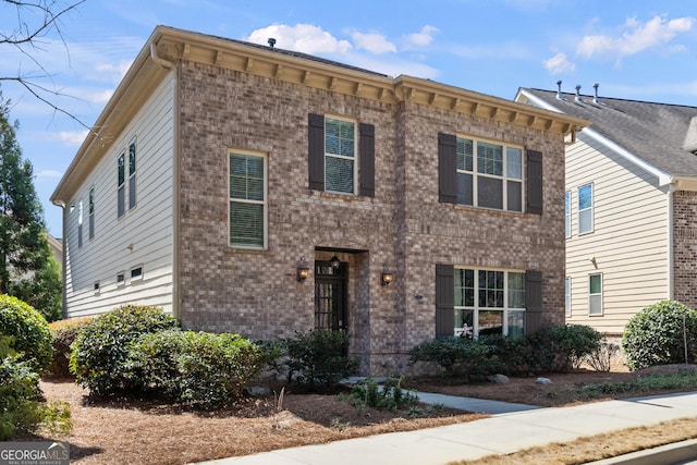 view of front facade featuring brick siding