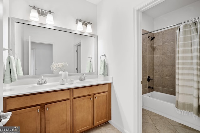 bathroom featuring a sink, double vanity, shower / tub combo, and tile patterned flooring