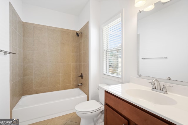 bathroom with tile patterned flooring, vanity, toilet, and shower / bathtub combination