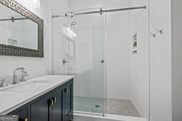 bathroom with vanity and a shower stall