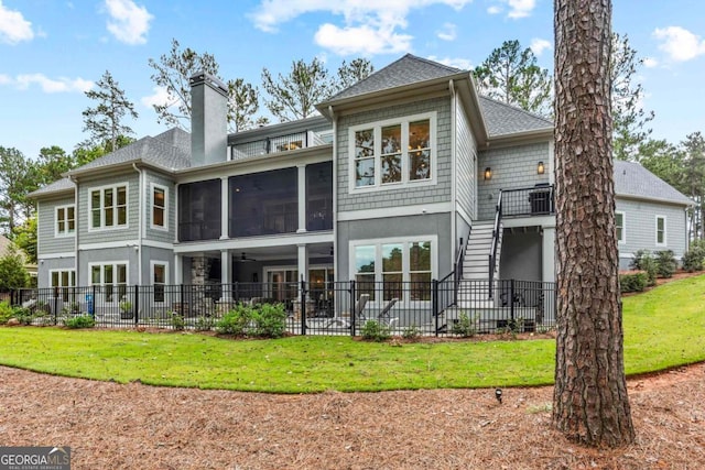 back of property featuring a patio, fence, a sunroom, a chimney, and stairs