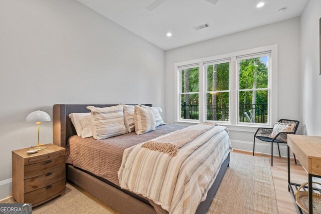 bedroom featuring visible vents, recessed lighting, light wood-type flooring, and baseboards