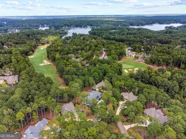 bird's eye view with a forest view, a water view, and golf course view