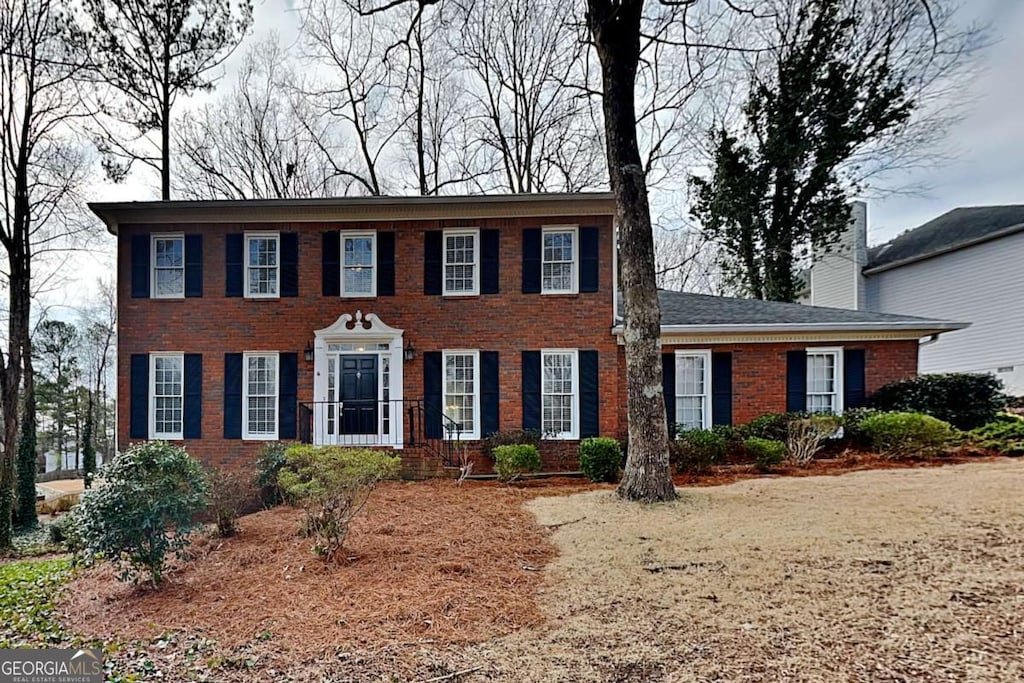 colonial house with brick siding