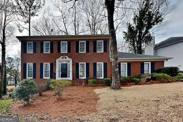 colonial house with brick siding