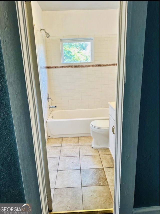 full bath with toilet, bathtub / shower combination, vanity, and tile patterned flooring