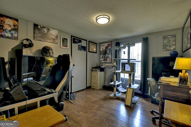 office featuring a textured ceiling and wood finished floors