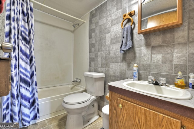 full bathroom featuring tasteful backsplash, toilet, vanity, tile walls, and shower / bathtub combination with curtain