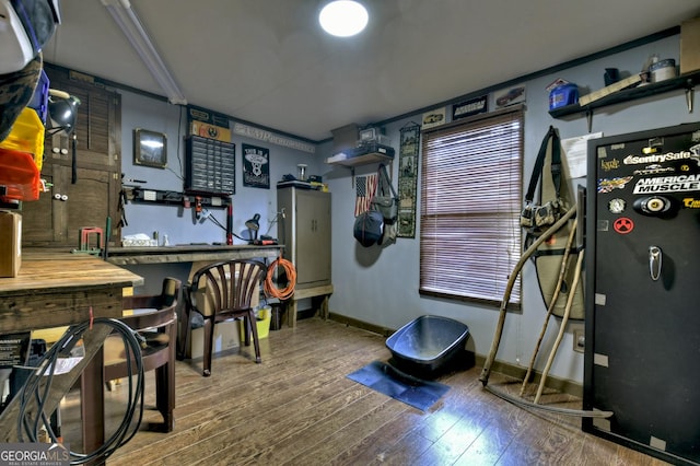 game room with hardwood / wood-style floors and baseboards