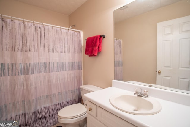 full bath with vanity, a shower with shower curtain, and toilet