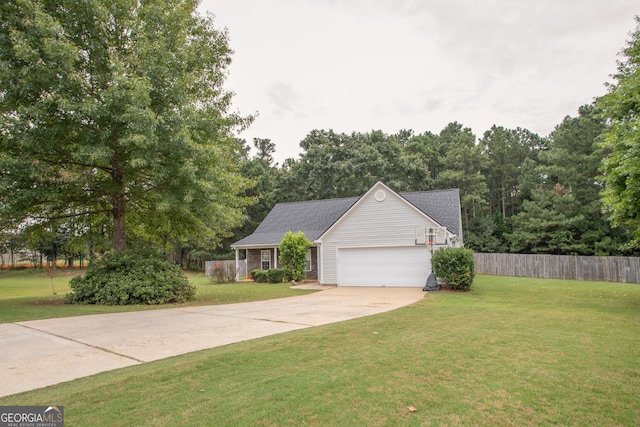 view of front facade with driveway, a front lawn, fence, a garage, and brick siding