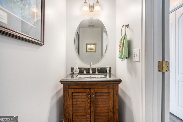 bathroom featuring vanity and a chandelier