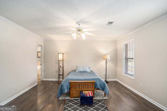 bedroom featuring ornamental molding, baseboards, and wood finished floors