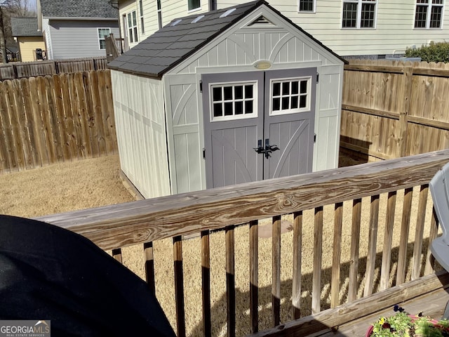 view of shed featuring a fenced backyard