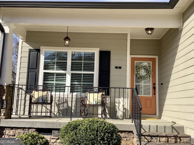 entrance to property featuring a porch