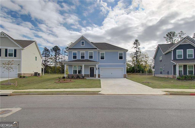 craftsman house with a front lawn, concrete driveway, cooling unit, and a garage