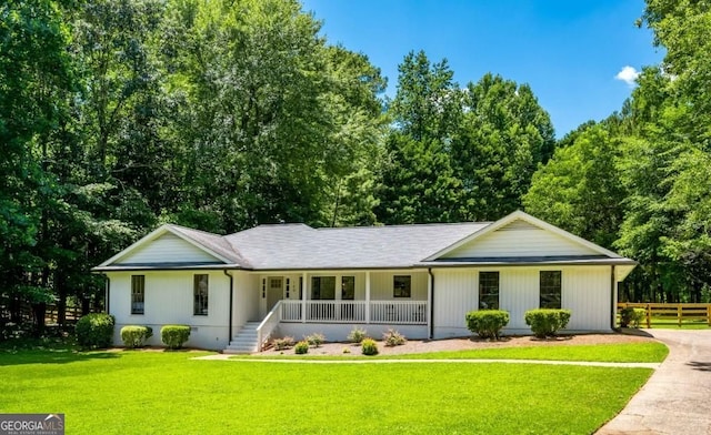 single story home with crawl space, a porch, a front yard, and fence