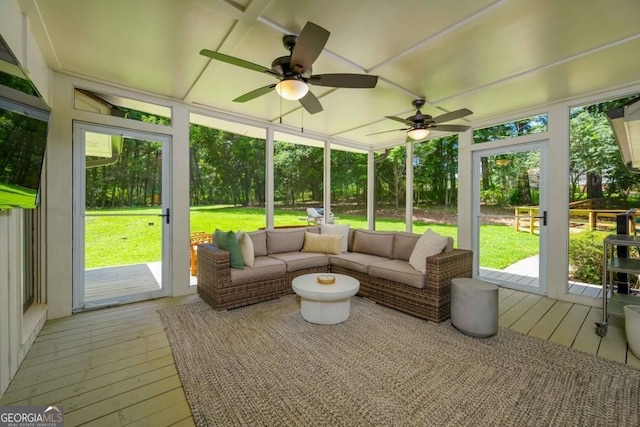 sunroom featuring ceiling fan