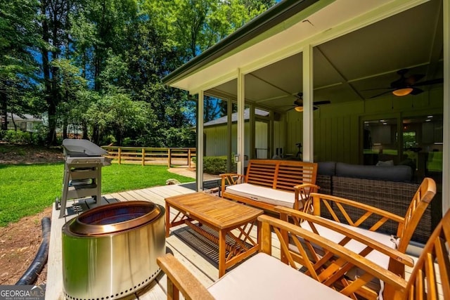 view of patio / terrace featuring outdoor lounge area, fence, and ceiling fan