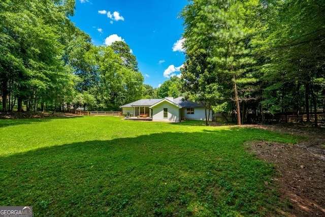 view of yard featuring fence