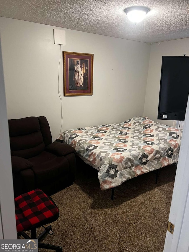 carpeted bedroom with a textured ceiling