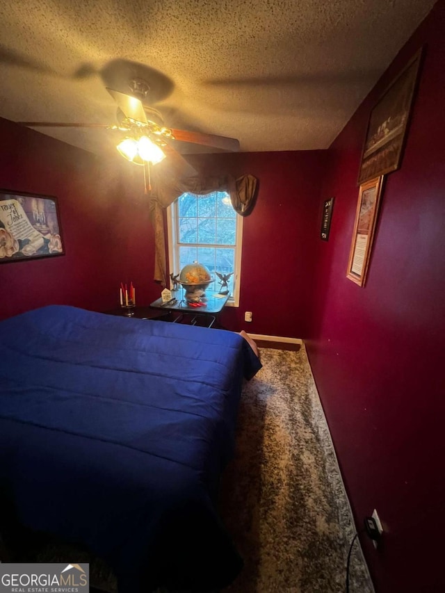 bedroom featuring a textured ceiling, ceiling fan, and carpet flooring