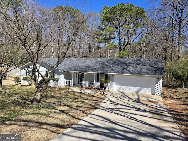 single story home with a porch, concrete driveway, an attached garage, and a shingled roof