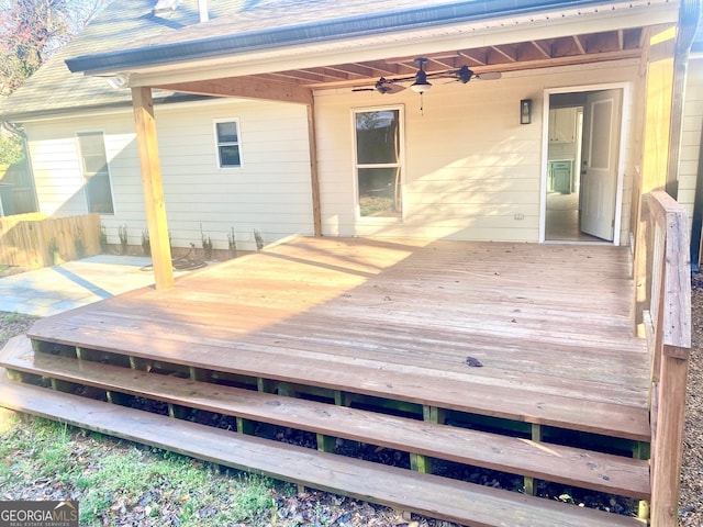 wooden deck with a ceiling fan