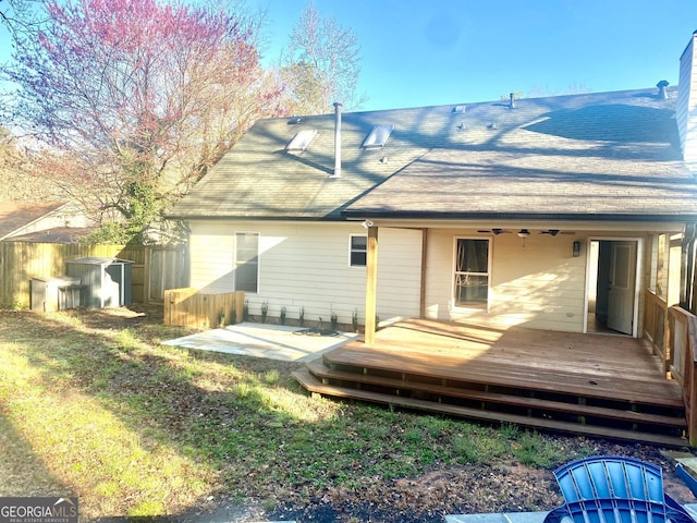 back of house with a wooden deck, a patio area, ceiling fan, and fence