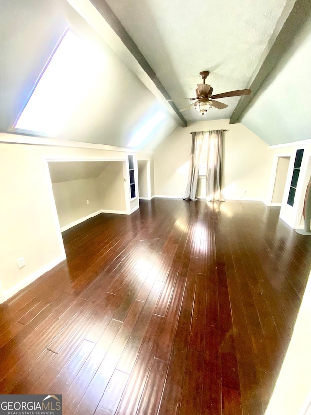 bonus room with hardwood / wood-style floors, built in shelves, a ceiling fan, baseboards, and lofted ceiling with beams