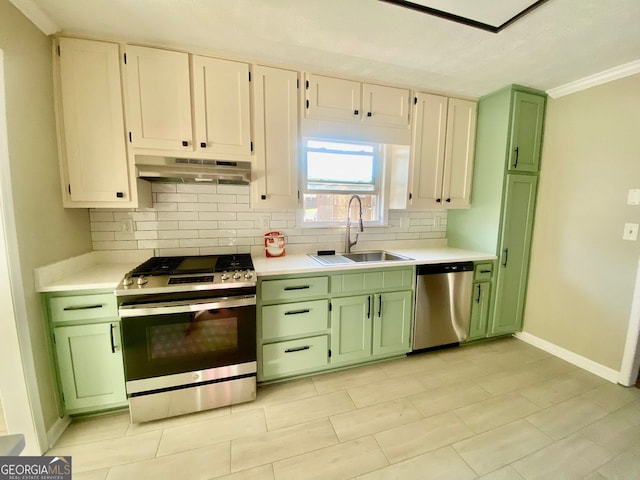 kitchen with under cabinet range hood, appliances with stainless steel finishes, and green cabinets