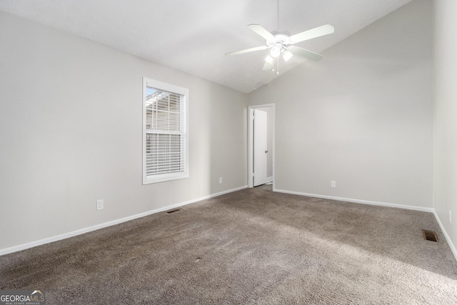 spare room featuring visible vents, carpet, ceiling fan, and vaulted ceiling