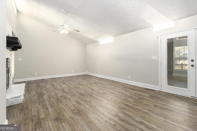 bonus room with vaulted ceiling, dark wood-style floors, baseboards, and a textured ceiling