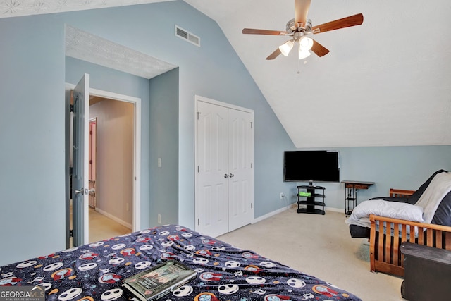 carpeted bedroom featuring visible vents, ceiling fan, baseboards, lofted ceiling, and a closet