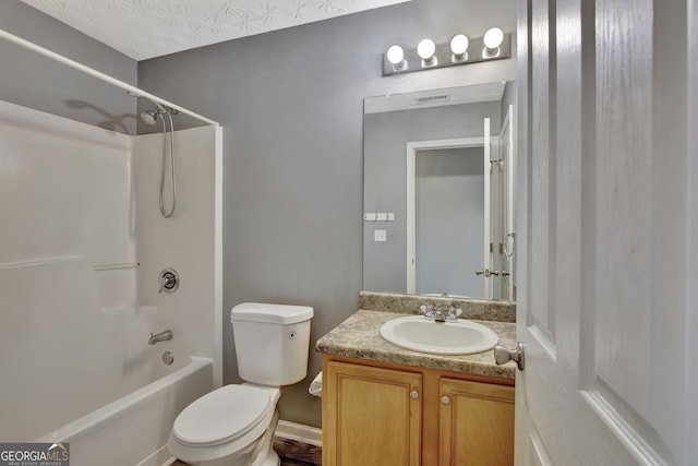 bathroom featuring vanity, shower / tub combination, and toilet