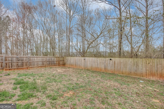 view of yard with a fenced backyard