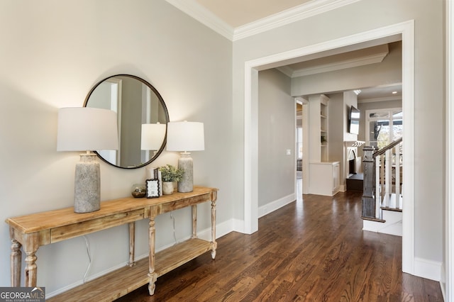 foyer entrance with ornamental molding, stairs, baseboards, and wood finished floors