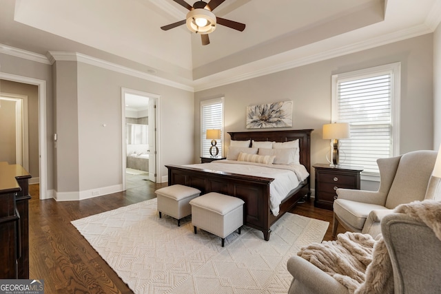 bedroom featuring crown molding, ceiling fan, baseboards, wood finished floors, and a raised ceiling