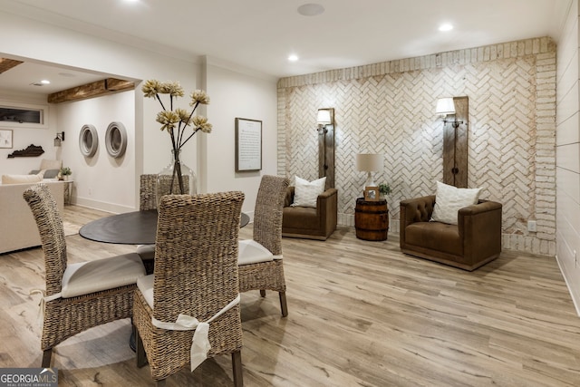 dining area with recessed lighting, baseboards, crown molding, and light wood-style floors