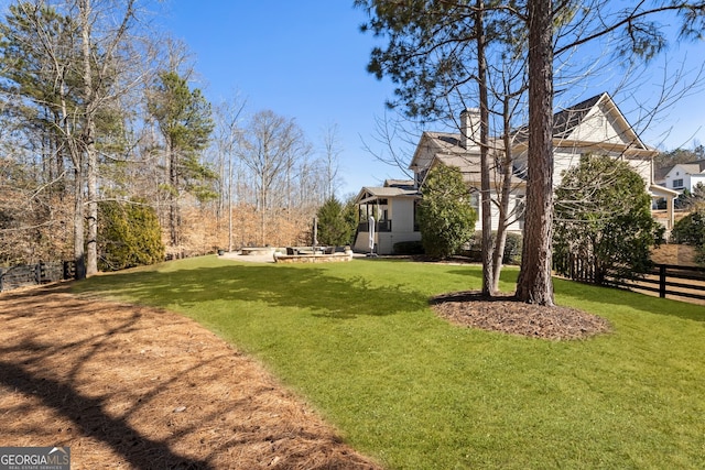 view of yard with a patio area and fence