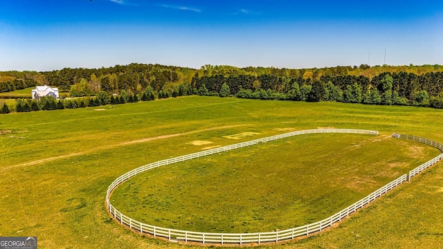 bird's eye view featuring a rural view and a wooded view