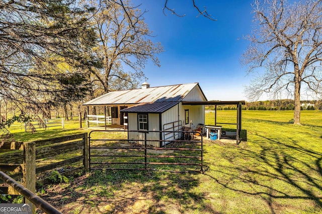 exterior space with an outbuilding, an exterior structure, and a carport