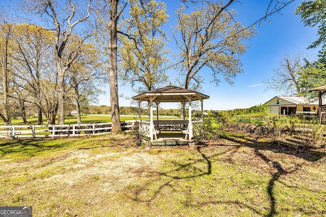 view of yard with a gazebo and fence